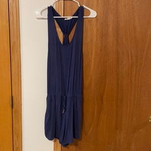 Blue romper from a boutique in St. Peter. Has pockets and a tie is the front.